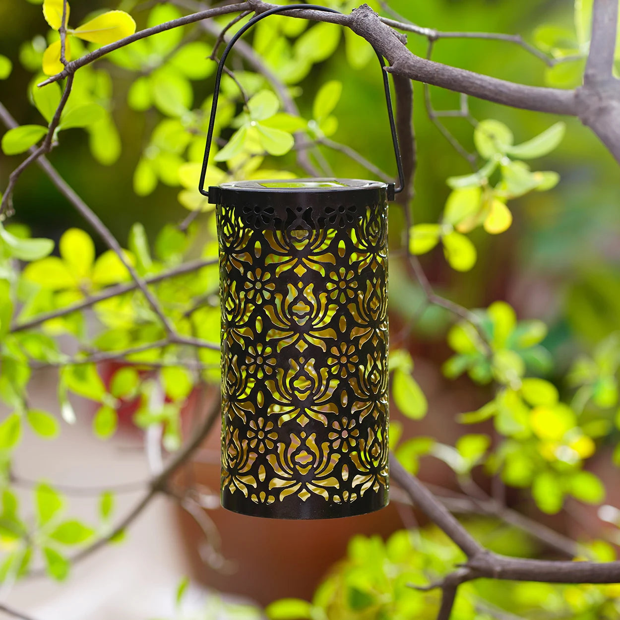 1 solar powered iron lantern, hollow design, suitable for outdoor gardens, terraces, party decorations and holiday gifts